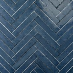 an image of a blue herringbone tile pattern