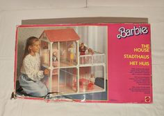 an old barbie doll house in its box with the instructions on how to build it