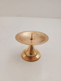 brass candlestick holder - vintage brass - candlestick - vintage home decor - candle - housewarming gift - wedding decor Weight: 91 grams Height 6 cm diameter 8 cm It is quite heavy for its size, Feel free to contact us if you have any questions. -- The perfect piece to add VINTAGE STYLE to your decor. Lovely piece in good "vintage" condition. All items will be carefully packed and shipped within 1 business days. To see our other items visit https://www.etsy.com/ca/shop/Maisondantiquites We will Candle Altar, Vintage Brass Candlesticks, Brass Candlestick, Brass Candle Holders, Brass Candle, Brass Candlesticks, Candle Stand, Vintage Home, Candlestick Holders