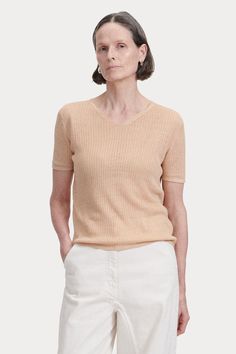 Pre-Fall 2024 Collection Fine Knit V-neck Top With Relaxed Fit, Classic Pointelle Knit Tops In Relaxed Fit, Beige V-neck Pointelle Knit Top, Classic Pointelle Knit Tops With Relaxed Fit, Relaxed Fit V-neck Pointelle Knit Top, Classic V-neck Spring Knit Top, Elegant V-neck Summer Sweater, Classic Beige Pointelle Knit Tops, Elegant Textured Knit V-neck Top