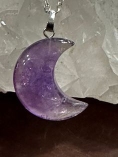 So excited to be able to offer these gorgeous half moon amethyst pendants! Moon-shaped jewelry is always so intriguing to me. These pendants are a stunning shade of purple. An 18-inch silver plated necklace is included. The moon shapes are approximately 1 inch long. Would make a great gift for the star-minded folks in your life! Purple Moon Shaped Spiritual Jewelry, Spiritual Purple Moon Shaped Jewelry, Spiritual Purple Moon-shaped Jewelry, Celestial Amethyst Purple Necklace, Celestial Purple Amethyst Necklace, Spiritual Purple Necklace With Moon Charm, Handmade Purple Crescent Jewelry, Purple Crescent Spiritual Jewelry, Purple Amethyst Moon Phase Jewelry