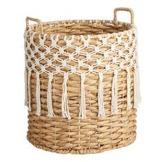 a woven basket with tassels on it