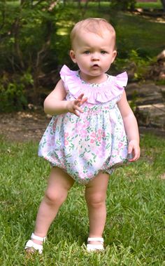 Meet Isla- Your little one's go-to floral dress for the warmer months. She's comfy, soft, and features the most gorgeous pink ruffled collar with smocking details. 100% Cotton, lined, with button back closure. * Matching Bubble Available. Spring Pink Smocked Dress With Flutter Sleeve, Spring Playtime Bubble Romper With Ruffles, Cute Floral Print Bubble Romper For Playtime, Spring Cute Bubble Romper With Ruffle Sleeves, Flutter Sleeve Bubble Romper With Ruffles For Playtime, Pink Smocked Dress With Ruffle Sleeves, Playful Floral Print Bubble Romper For Spring, Cute Bubble Romper With Ruffle Hem For Spring, Cute Spring Bubble Romper With Ruffle Hem