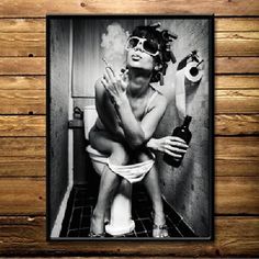 a black and white photo of a woman sitting on a toilet holding a beer in her hand