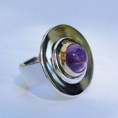 Natural Amethyst Ring Beautiful Surprise Wedding Gift This Beautiful Ring is Made of Natural Amethyst and blend with Solid 925 Sterling Silver. Item Description Mainstone - Amethyst Jewelry Type - Ring Material - 925 Sterling Silver Gender - Men Metal Purity - 925 Color - Purple About Gemstone - Amethyst is linked to the element of wind. It is believed to prevent intoxication. This purple gemstone is associated with Royalty. This stone has amazing healing power and very helpful in purifying the Amethyst Wedding, Surprise Wedding, Fire Opal Ring, Amethyst Gem, Peridot Ring, Healing Power, Amethyst Jewelry, Plated Ring, Silver Rings Handmade