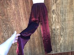 Vintage size 8 shimmer burgundy pants. Please check measurements to ensure fit. Condition - has a scuff at back of right knee- see last photo. Measurements taken across front laid flat 12.5" across front of waist -stretches to 17.5" 20" across front of hips 14" rise 30" inseam Burgundy Stretch Pants For Night Out, Stretch Burgundy Pants For Party, Stretch Burgundy Bottoms For Party, Stretch Burgundy Bottoms For Night Out, Burgundy Pants, Waist Stretches, Womens Pants, Favorite Outfit, Bathing Beauties