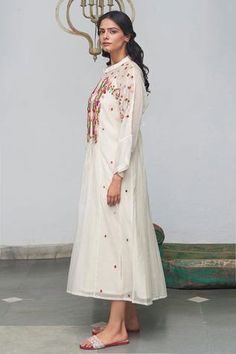 Ivory dress with floral embroidery around the neckline and mandarin collar. Comes with inner slip.
Component: 2
Embroidered
Neckline: Mandarin Collar
Sleeve Length: Full
Fabric: Chanderi Cotton
Color: White
Front button placket - Aza Fashions White Anarkali Embroidered Festive Dress, White Anarkali Embroidered Dress For Festive Occasions, White Embroidered Anarkali Dress, Traditional Resham Embroidery Dresses For Spring, Anarkali Style Embroidered Off White Dress, Floral Embroidery Straight Kurta Dress For Wedding, Traditional Off White Dress With Resham Embroidery, Festive Resham Embroidered Dress For Spring, Festive Off White Dress With Intricate Embroidery