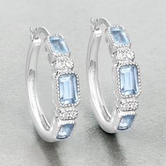 "Blue Topaz Earrings, Genuine Blue Topaz Earrings Sterling Silver, Blue Topaz Earrings for Women, December Birthstone Hoop Earrings for Her Stand out from the crowd with these glittering stylish earrings! Their unique shape and can't-be-missed coloring are the perfect way to make your outfit pop! Made of genuine blue topaz gemstones, these have a total weight of 2.66 carats. The earrings are made of rhodium plated .925 sterling silver. Product Details:  .925 Sterling Silver Item Type: Earrings G Blue Fine Jewelry Earrings With Accent Stones, Blue Cubic Zirconia Hoop Earrings For Anniversary, Blue Hoop Earrings Fine Jewelry, Fine Jewelry Blue Hoop Earrings, Blue Gemstone Hoop Earrings, Blue Topaz Round Pierced Earrings, Blue Topaz Round Earrings, Nickel-free Blue Topaz Earrings, Nickel-free Blue Topaz Dangle Earrings