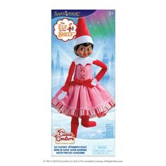 the elf doll is wearing a pink dress