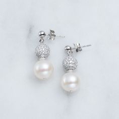 Beautiful Pearl And Pave Cz 1.48 Cttw On Silver Pierced-Drop Pearl With Cz Ball Accents. Silver Out 925 Mark. New With Manufacturers (Wholesale) Tags. Classic Dangle Earrings With Pave Setting, Silver Drop Bridal Earrings With Pave Setting, Silver Bridal Drop Earrings With Pave Setting, Sterling Silver Bridal Earrings With Pave Setting, Silver Bridal Earrings With Pave Setting, Sterling Silver Dangle Pearl Earrings In Diamond White, Diamond White Dangle Pearl Earrings In Sterling Silver, Diamond White Sterling Silver Dangle Pearl Earrings, Sterling Silver Pave Setting Drop Earrings