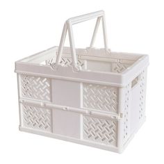 a white plastic basket with handles and lattice design on the bottom, sitting against a white background