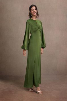 Be the center of attention in our Garcelle Maxi Dress. This beautiful stretch satin design combines a high neckline, balloon sleeves, twisted-front detailing and open back to create an enchanting statement at your next soiree. Green Mother Of The Bride Dresses, Olive Green Maxi Dress, Atelier Dress, Satin Design, Green Maxi Dress, Green Maxi, Maxi Dress Green, Stretch Satin, Dress Maxi