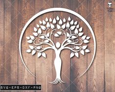 a paper cut tree with leaves in a circle on a wooden background, suitable for laser cutting