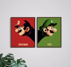 two framed posters depicting mario and luigi's faces, one with the word luigi on it