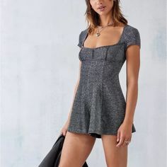 Brand: Urban Outfitters Size: Xs Color: Black Shimmer Condition: Nwt Add Metallic Detailing To Your Wardrobe With This Sparkly Romper. Complete With A Square Neck, Short Sleeves, A Fitted Bodice And Floaty Shorts. Finished With A Low Scoop To Reverse And Self-Tie Closure. Sparkly Playsuit, Sparkly Romper, Hoodie Romper, Urban Outfitters Romper, Plaid Jumpsuit, Flowy Romper, Cutout Shorts, Fitted Romper, Belted Romper