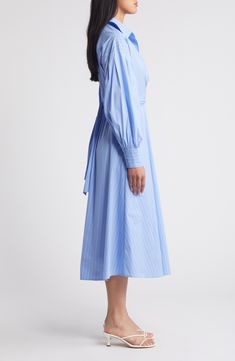 Shirtdress style gets a graceful drape in a cotton-blend midi designed with a wrapped bodice. 47" length (size Medium) Ties at back Spread collar Surplice V-neck Long sleeves with four-button cuffs Partially lined 70% cotton, 27% nylon, 3% spandex Hand wash, dry flat Imported Elegant Cotton Midi Dress With Gathered Sleeves, Spring Cotton Midi Shirt Dress, Relaxed Fit Long Sleeve Cotton Midi Dress, Chic Long Sleeve Cotton Midi Dress, Spring Shirt Dress With Gathered Sleeves For Work, Spring Chic Shirt Dress With Gathered Sleeves, Chic Spring Shirt Dress With Gathered Sleeves, Spring Workwear Shirt Dress With Gathered Sleeves, Elegant Cotton Shirt Dress With Tie Waist