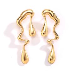 Add a touch of elegance to any outfit with our Irregular Water Drops Statement Drop Earrings. These unique earrings feature irregularly shaped water drops that will catch the light and make you shine. Perfect for a night out or special occasion, these earrings are sure to make a statement and elevate your style. Latest Earrings Design, Gold Drip, Geometric Solids, Metal Drop, Asymmetrical Earrings, Statement Drop Earrings, Modern Earrings, Chic Fashion, Shopping Spree