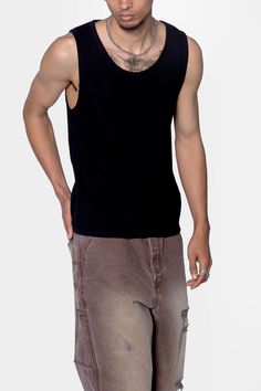 the Waffle Knit Tank is a 100% cotton tank is perfect as a base layer or worn alone. the tank features taping at the neck and arm openings, a flat hem, and is constructed in a ribbed material. details flat hem 100% ribbed cotton fabric Model is 6’0, 140 lbs and wears a size medium Casual Ribbed Tank Top For Streetwear, Stretch Ribbed Tank Top For Streetwear, Casual Ribbed Vest With Tank Straps, Cotton Crew Neck Sweater Vest For Everyday, Black Cotton Muscle Tee For Layering, Cotton Stretch Sweater Vest, Everyday Cotton Crew Neck Sweater Vest, Everyday Cotton Sweater Vest With Crew Neck, Crew Neck Tank Top For Layering With Ribbed Neckline