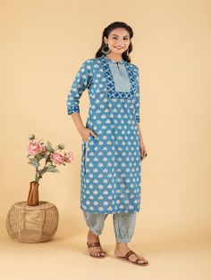 Blue dabu flower printed straight kurta, has a mandarin collar, mirror and katha embroidered yoke, three-quarter sleeves and stripes Print afgani Pants has Elasticated Waistband Fabric: 100% Cotton Color: Blue Note: Available in other colors Wash Care Instruction - Dry Clean Only The product will be shipped within 15-20 days of order placed Size Chart: Kurta Size XS S M L XL XXL XXXL Bust 36 38 40 42 44 46 Waist 32 34 36 38 40 42 Hip 38 40 42 44 46 48 Shoulder 14 14.5 15 15.5 16 16.5 Armhole 18 Casual Long Sleeve Cotton Salwar Kameez, Spring Cotton Tunic Set, Bohemian Spring Block Print Sets, Bohemian Spring Sets With Block Print, Spring Bohemian Set With Block Print, Spring Block Print Straight Kurta Set, Cotton Bandhani Print Sets For Spring, Casual Straight Kurta Set For Eid, Casual Eid Straight Kurta Set