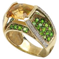 Unique Multi Color Gemstone Ring Center Yellow Citrine with side Diamonds And Green Tsavorite 10k Yellow Gold 6.4 grams Finger Size 7 Center Citrine is approx 10 x 8 mm. Made interesting like two Dimension / Layers with an unusual beauty. Oval Tsavorite Ring With Gemstone Accents, Green Citrine Rings With Accent Stones, Fine Green Citrine Jewelry, Formal Green Citrine Jewelry, Tsavorite Rings With Gemstone Accents For Anniversary, Green Multi-stone Topaz Ring For Formal Occasions, Formal Green Multi-stone Topaz Ring, Green Citrine Jewelry With Gemstone Accents, Formal Multi-stone Peridot Jewelry