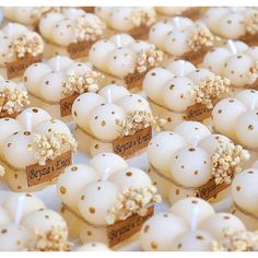 there are many small cupcakes with gold sprinkles on them in rows