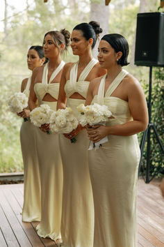 the bridesmaids are all dressed in beige dresses