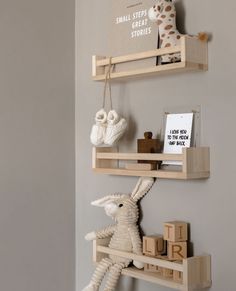 two wooden shelves with stuffed animals on them