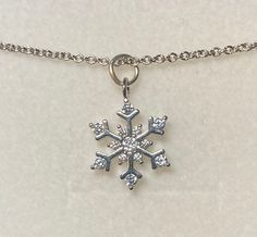 This necklace is made with gold or rhodium plated brass with cubic zirconia. The snowflake measures: 15mm x 11mm x 2mm. You can choose from 16 or 18 inch necklace. Diamond Snowflake Necklace For Gift, Silver Snowflake Necklace With Cubic Zirconia, Silver Cubic Zirconia Snowflake Necklace, Dainty Silver Snowflake Necklace, Gold Snowflake Necklace, Gold Orchid, Snowflake Necklace, Gold Snowflake, Silver Snowflakes