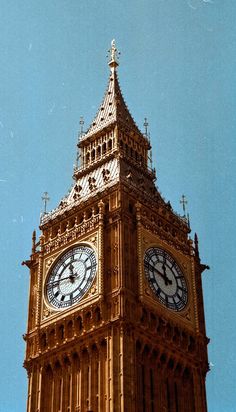 the big ben clock tower towering over the city of london on a clear blue day