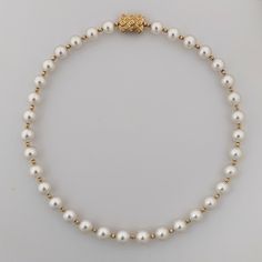 This necklace radiates elegance and sophistication with its magnificent and airy design. It features exquisite Australian White South Sea pearls with a fine luster and clean surfaces with only very minor inclusions. The pearls are round/almost round, ranging in size from 9 to 11mm. They threaded intermittently with 3mm 14K yellow gold faceted beads. The necklace is secured with a 14K yellow gold clasp that is embellished with 0.11ct diamonds (NC/SI). This necklace is a true statement piece, dest Luxury High Luster White Pearl Necklace, Elegant Akoya Pearl Round Bead Necklaces, Luxury Pearl Necklaces With Round Beads, Elegant Pearl Necklace With Round Beads Pendant, Classic Formal Pearl Necklace With Round Beads, Luxury High Luster Pearl White Pearl Necklace, Classic Pearl Necklace For Formal Occasions, Luxury High Luster Pearl White Necklace, Formal Classic Pearl Necklace