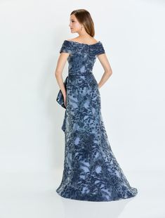 This Montage by Morilee evening gown is breathtaking! M524, showcases a classy off-shoulder neckline with thick cap sleeves and zipper back closure. The stunning silhouette will lay on your figure just right and is beautifully decorated with gorgeous floral detail, making it the perfect gown for Mother of the bride! Elegant Off-shoulder Evening Dress For Mother Of The Bride, Elegant Off-shoulder Mother Of The Bride Dress For Gala, Boat Neck Evening Dress With Fitted Bodice, Fitted Boat Neck Evening Dress For Gala, Elegant Boat Neck Evening Dress For Gala, Boat Neck Dress With Fitted Bodice For Gala, Formal Boat Neck Evening Dress, Boat Neck Gala Dress With Fitted Bodice, Elegant Off Shoulder Dress With Short Sleeves For Evening