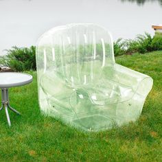 an inflatable chair and table sitting on the grass