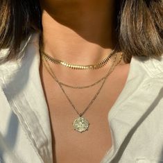 The perfect vintage-inspired layered duo. Consisting of two necklaces, mix and match with our patented design.Figaro Chain Chain width 2mm Adjustable chain: 17-19in (43-48cm) Coin Necklace Pendant Diameter 0.6in (1.5cm) Italian Figaro chain, 2mm Adjustable chain: 17in-21in (44-53cm) Learn more Gold Vermeil Italian chain, made in NYC Hypoallergenic, lead and nickel free #194G-290G Full Outfits, Layered Choker Necklace, Silver Necklace Set, Gold Coin Necklace, Coin Pendant Necklace, Dainty Gold Necklace, Figaro Chain, Gold Coin, Necklace Dainty