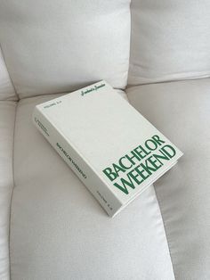 a book sitting on top of a white couch