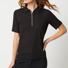 a woman wearing a black polo shirt with zippers on the collar and side pockets