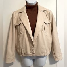 Takes Me Back To The 80’s Color Falls Between Cream And Tan. Single Snap Button At The Waist. Four Pockets. (Turtleneck In Picture Sold Separately). Fall Beige Leather Jacket With Pockets, Beige Leather Jacket With Button Closure For Fall, Beige Casual Leather Jacket With Button Closure, Beige Leather Jacket With Button Closure For Work, Beige Leather Jacket With Pockets For Fall, Trendy Beige Collared Cropped Jacket, Spring Beige Leather Jacket With Button Closure, Classic Beige Collared Cropped Jacket, Beige Classic Collared Cropped Jacket