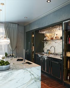 a kitchen with marble counter tops and black cabinetry next to a window filled with bookshelves