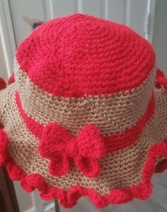 hand made and home made cute cream and bright red vintage styled bucket hat. with a red band and ribbon. 80% acrylic 20% wool Fun Red Adjustable Bucket Hat, Fun Red Bucket Hat, Red Adjustable Crochet Bucket Hat, Red Brimmed Crochet Hat For Beach, Red Crochet Wide Brim Hat, Red Wide Brim Crochet Hat, Red Crochet Hat With Adjustable Short Brim, Handmade Red Summer Hat, Vintage Red Hat For The Beach