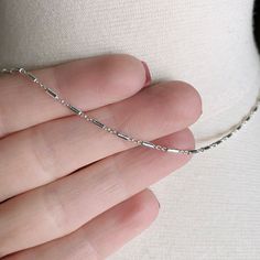 One beautiful sterling silver tube/bar chain necklace with sterling silver lobster clasp.  Perfect for layering or wearing alone.  Details: all 925 sterling silver components used in this necklace - 925 sterling silver tube chain - 925 sterling silver lobster clasp, wire/beads, extender chain Length of the necklace - please select the length you prefer  leigholearyjewelry.etsy.com Sterling silver is an alloy containing metals that react with chemicals found in air and produce tarnish; high moist Silver Dainty Bar Necklace For Everyday, Silver Bar Necklace With Delicate Chain For Everyday, Dainty Sterling Silver Bar Necklace For Everyday, Silver Bar Necklace With Delicate Chain, Everyday Silver Bar Necklace With Delicate Chain, Delicate Silver Cable Chain Necklace, Minimalist Silver Bar Necklace As Gift, Minimalist Sterling Silver Satellite Chain Necklace, Silver Bar Necklace With Adjustable Chain As Gift