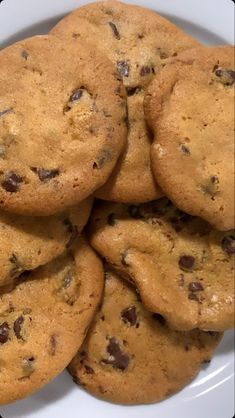 a white plate topped with chocolate chip cookies