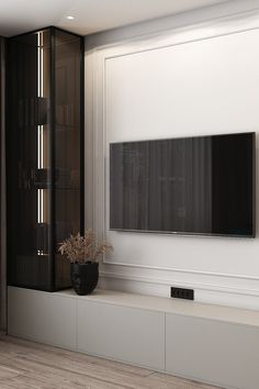 a large flat screen tv mounted to the side of a wall