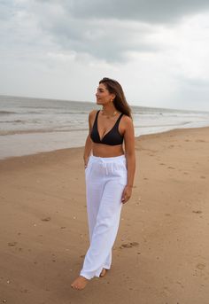 Made in Italy Crafted from lightweight, cotton gauze, these pants provide ultimate comfort while keeping you effortlessly cool. Features like side pockets, an elastic waistband with drawstring, and a flowy silhouette make these pants the perfect summer staple. Not lined and slightly transparent for a breezy, summery feel. Our models also wear the white Perrine shirt One size (fits from 2-4-6-8) Length 39.76 in - Width 11.42 in 100% cotton Washing: handwash or delicate Summer Harem Pants With Loosely Fitted Hips For Relaxation, Summer Relaxation Sweatpants With Elastic Waistband, Relaxed Summer Sweatpants, Casual Summer Harem Pants For Relaxation, Summer Bottoms With Elastic Waistband For Relaxation, Cotton Pants For Summer Relaxation, Summer Cotton Pants For Relaxation, Relaxed Fit Wide-leg Harem Pants For The Beach, Linen Pants For Beach Season Loungewear