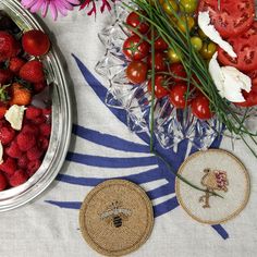 strawberries, tomatoes and other fruit are on the table