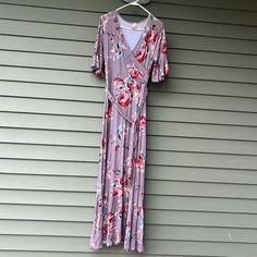 This Is So Beautiful! Purchased Two Dresses To Wear To A Summer Wedding And Went With The Other One. Can’t Find The Tag, But The String That The Tag Was On Is Still Attached. This Dress Has Never Been Worn. This Has A Size Tag Of Small But Would Definitely Fit A Medium Due To The Rayon/Spandex Blend. Approximate Measurements Are 17 3/4 Inches Pit To Pit And 55 Inches From Shoulder To Bottom Of Dress. This Has A Detachable Matching Belt. The Background Color Is A Light Lavender With Beautiful Pin Lavender Floral Print Short Sleeve Dress, Spring Mauve Maxi Dress With Floral Print, Casual Purple Short Sleeve Maxi Dress, Lavender V-neck Floral Print Maxi Dress, Lavender Short Sleeve Maxi Dress, Lavender Floral Print V-neck Maxi Dress, Short Sleeve Lavender Maxi Dress For Spring, Mauve Fitted V-neck Maxi Dress, Fitted Mauve V-neck Maxi Dress