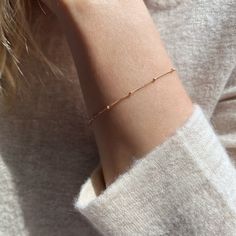 "We love the elegant look and lightweight feel of our 14k gold filled satellite bracelet. Alone or stacked, this dainty gold chain bracelet is the perfect everyday bracelet.  SIZING GUIDE * 6\" (XXS/XS) * 6.5\" (Small) * 7\" (Medium) * 7.5\" (Large/XL) Please see our photos to learn how to measure the perfect length. CRAFTSMANSHIP  Jewelry is handmade by us in our NYC studio. We focus on craftsmanship and quality using only the highest quality materials and handpicked genuine gemstones.  PACKAGING We take pride in creating beautifully packaged orders. Jewelry arrives delicately wrapped in tissue and placed in a kraft box inside a logo drawstring pouch. Your package will arrive nice enough to gift someone.  If you need your order by a certain date, it is very important to send us a message Dainty Satellite Chain Bracelet For Everyday, Everyday 14k Gold Satellite Chain Bracelet, Delicate Gold Bracelet With Satellite Chain For Everyday, Everyday Gold Bracelet With Satellite Chain, Delicate Satellite Chain Bracelet, Everyday 14k Gold-filled Delicate Chain Bracelets, Everyday 14k Gold-filled Satellite Chain Bracelet, Delicate Bracelets With Delicate Chain For Everyday, Dainty Paperclip Bracelet With Delicate Chain In 14k Gold