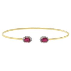 This 18KT Yellow Gold Flex Diamond and Ruby Bangle Bracelet is crafted with 1.69CT-TW of African rubies and 0.13CT-TW of diamonds, perfect for adding an exquisite touch of luxury to any look. Sapphire Bangle, Modern Bangle, Ruby And Diamond Necklace, Ruby Bangles, Modern Bracelets, Yellow Gold Bangle, Fancy Yellow Diamond, Diamond Bangles Bracelet, Cuff Bangle Bracelet