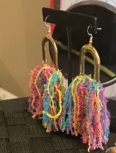 Gold brass accent with multi color tassels Yarn Earrings, Diy Tassel Earrings, Tassel Crafts, Earrings Tassel, Jewelry Making Business, Diy Tassel, Earring Stand, Handmade Earrings Beaded, Chunky Jewelry