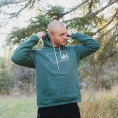 Montana Tree Outline Fleece Hoodie Unisex - Green - The Montana Scene Long Sleeve Fleece Hoodie For Outdoor Activities, Casual Fleece Hoodie For Outdoor, Casual Outdoor Fleece Hoodie, Green Hoodie For Outdoor Activities In Winter, Long Sleeve Fleece-lined Sweatshirt For Outdoor Activities, Long Sleeve Sweatshirt With Fleece Lining For Outdoor Activities, Fleece-lined Long Sleeve Sweatshirt For Outdoor Activities, Cozy Fit Hooded Sweatshirt For Outdoor, Cozy Winter Sweatshirt For Outdoor Activities