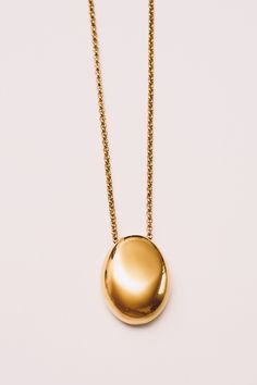 This minimal necklace has a mirrored finish with a high polish shine to add subtle sophistication to any look. Dimensions: Hangs 28" including pendant (1.25") (32mm) Materials: Stainless Steel, 18k Gold plating Ships in a branded jewelry pouch and box, perfect for gift giving! Yellow Gold Necklace With Large Oval Pendant, Modern Gold Plated Oval Pendant Necklace, Everyday Yellow Gold Necklace With Large Pendant, Modern Jewelry With Oval Pendant Cable Chain, Gold Necklace With Large Pendant, Everyday Gold Necklaces With Polished Finish, Timeless Gold Necklace With Large Pendant, Minimalist Yellow Gold Jewelry With Large Pendant, Modern Yellow Gold Necklace With Large Pendant