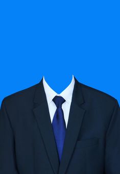 a man in a suit and tie standing against a blue background